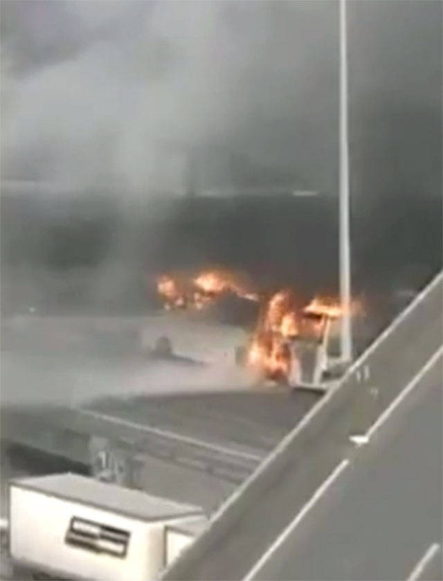 A bus carrying the Stanford University track and field team caught fire on I-5 in Seattle on Friday. (Washington State Department of Transportation)