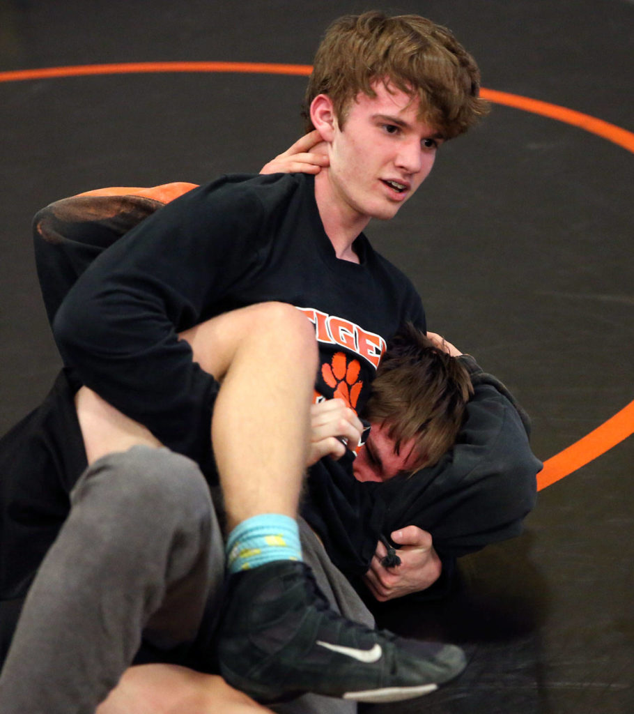 Granite Falls’ Christian Roberts wrestles teammate Ashton Buchholz on Thursday in Granite Falls. (Kevin Clark / The Herald)
