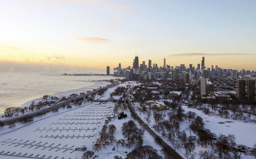 Chicago’s lakefront is covered with ice on Wednesday. Temperatures are plummeting in Chicago as officials warn against venturing out into the dangerously cold weather. (AP Photo/Teresa Crawford)
