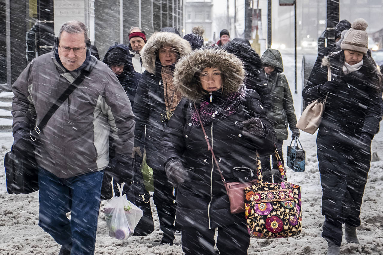 Morning commuters face a tough slog on Wacker Drive in Chicago on Monday. (Rich Hein/Chicago Sun-Times via AP)