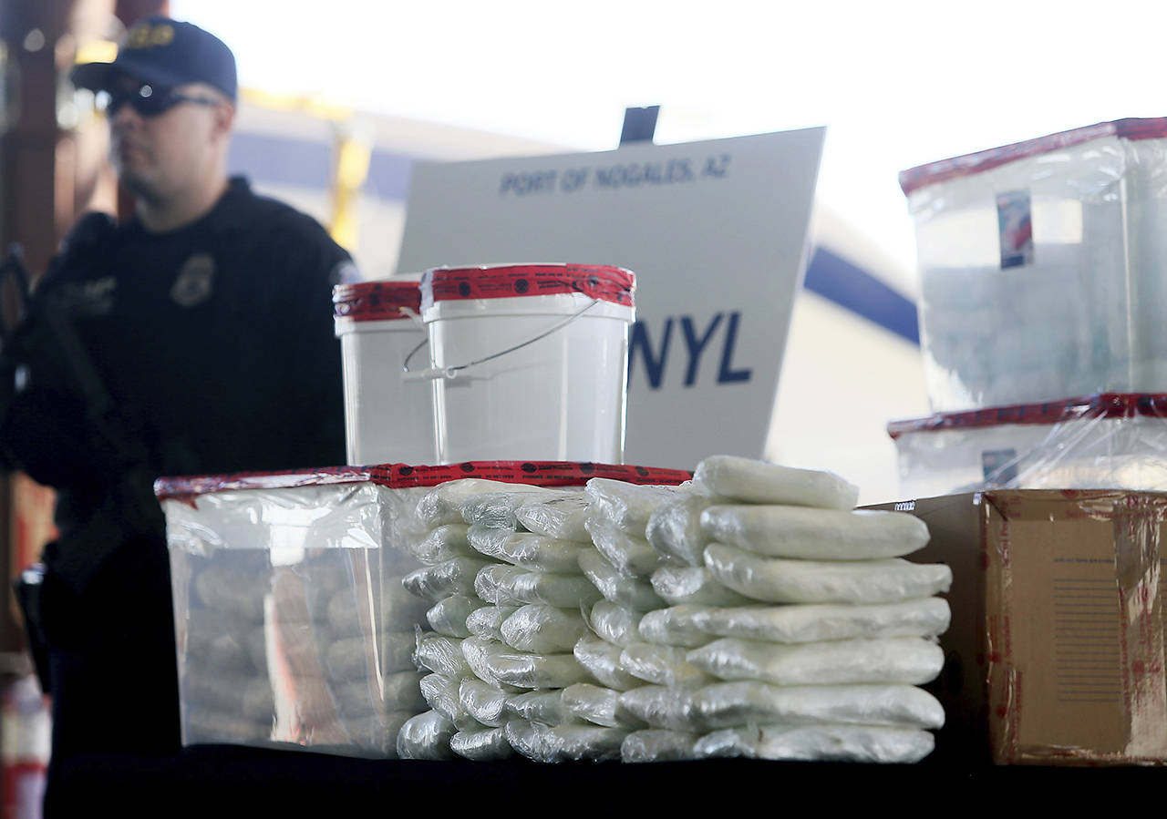A display of the fentanyl and meth that was seized by Customs and Border Protection officers over the weekend at the Nogales Port of Entry is shown during a press conference Thursday in Nogales, Arizona. U.S. Customs and Border Protection officials captured nearly 254 pounds (114 kilograms) of the deadly synthetic opioid fentanyl from a secret compartment inside a load of Mexican produce heading into Arizona. (Mamta Popat/Arizona Daily Star via AP)