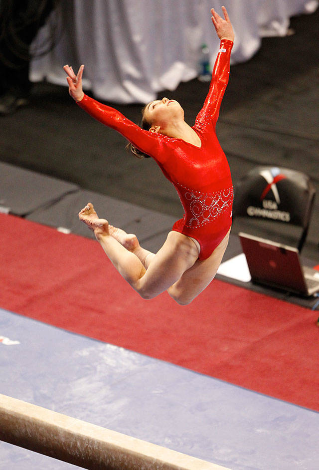 USA’s Katelyn Ohashi jumps above the beam March 16, 2012, during the Pacific Rim Gymnastics Championships Women’s Finals at Xfinity Arena in Everett. (Jennifer Buchanan / The Herald)