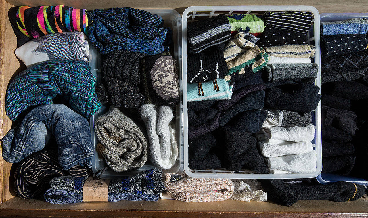 Jackie Noble’s sock drawer uses different containers to keep organized. Noble 72, organized her dresser clothes using the Marie Kondo method, to the point of labeling the items, (Andy Bronson / The Herald)