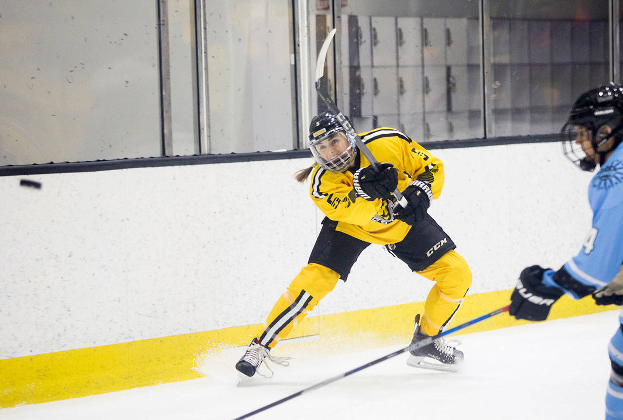 Boston’s Lexi Bender clears the puck during a National Women’s Hockey League game against Buffalo on Nov. 17, 2018, in Boston. (Photo by Michelle Jay)
