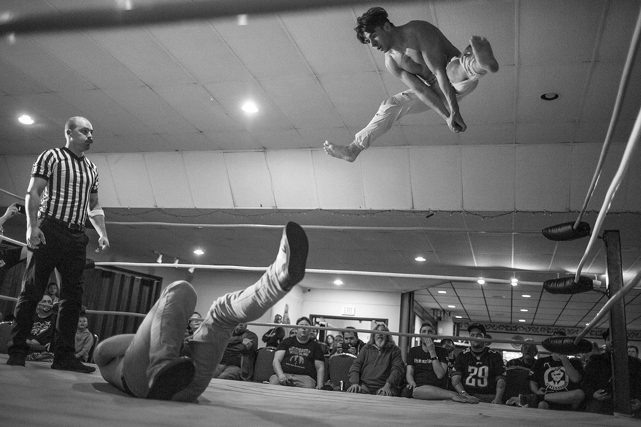 Judas Icarus of “The Strays” lands on “Cool Dad” Chris Ross in a wrestling match by Everett promoter Without A Cause held once a month on Sunday at Normanna Lodge. (Vitz Photos)