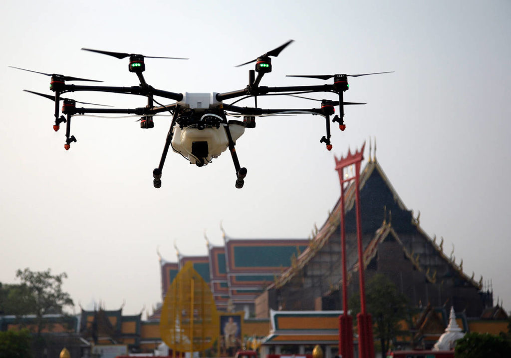 A drone is flown over the Suthat Temple in Bangkok, Thailand, Thursday. Bangkok’s municipal government displayed six drones that will be used to spray water over the city to help ease high levels of pollution. More than 400 schools in Thailand’s capital were shut for the rest of the week Wednesday due to increasing concern over dangerously unhealthy air pollution. (AP Photo/Sakchai Lalit)
