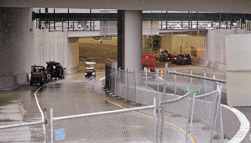 Fences surround the exit at the north portal of the new State Route 99 tunnel on Friday in Seattle. (AP Photo/Elaine Thompson)
