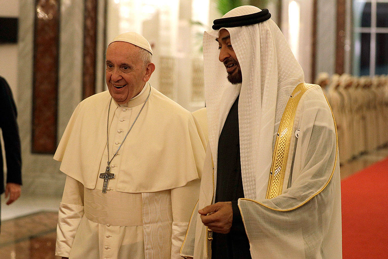 Pope Francis is welcomed by Abu Dhabi’s Crown Prince Sheikh Mohammed bin Zayed Al Nahyan, upon his arrival Sunday at the Abu Dhabi airport, United Arab Emirates. (AP Photo/Andrew Medichini, Pool)