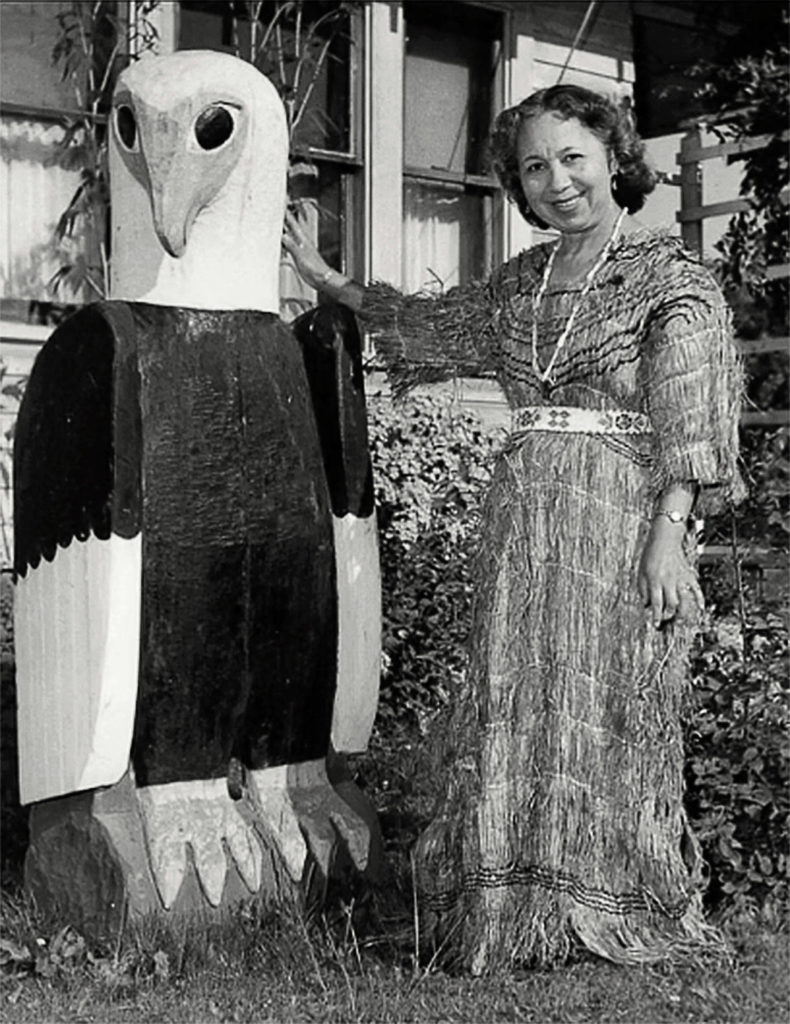 Harriette Shelton Dover, shown with a traditional carving, is the subject of a new film from the Tulalip History Project. She is credited with helping preserve the culture of her people. (Tulalip Tribes Hibulb Cultural Center)
