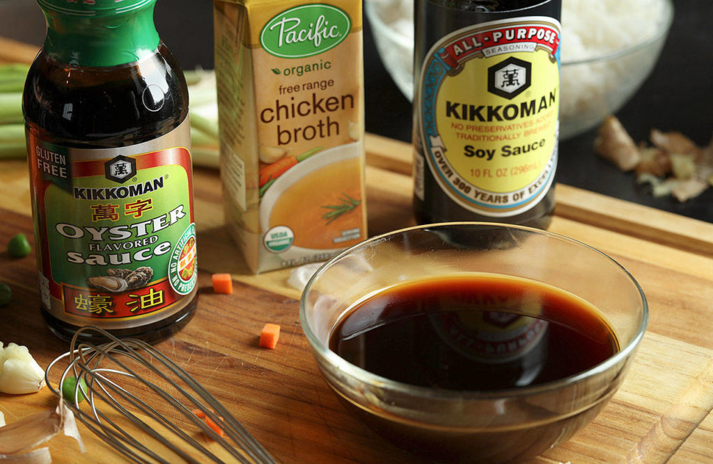 For the sauce, combine soy sauce, chicken stock and oyster sauce in a small bowl. (Abel Uribe / Chicago Tribune)
