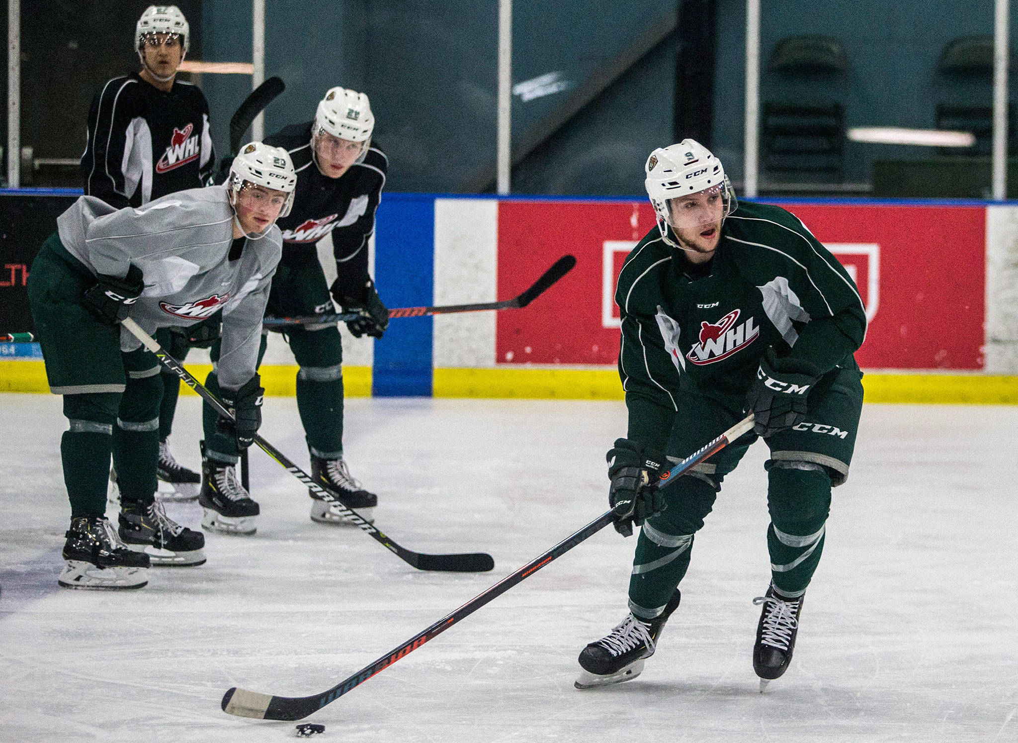 Silvertips teammates watch as Dawson Butt skates with the puck during a drill at practice on Wednesday, Nov. 7, 2018 in Everett, Wa. (Olivia Vanni / The Herald)