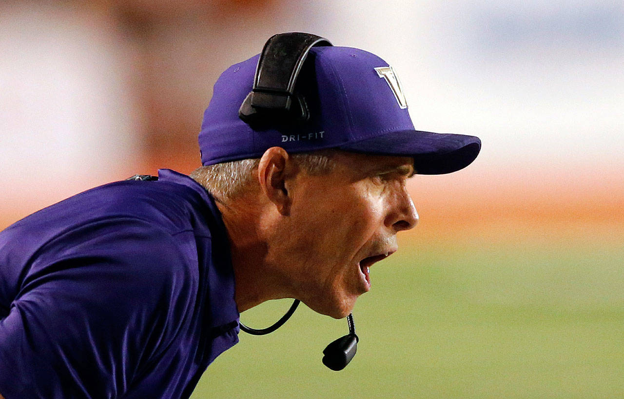 Washington football coach Chris Petersen shouts to his team in the second half of a Sept. 15 game in Salt Lake City. (AP Photo/Rick Bowmer)