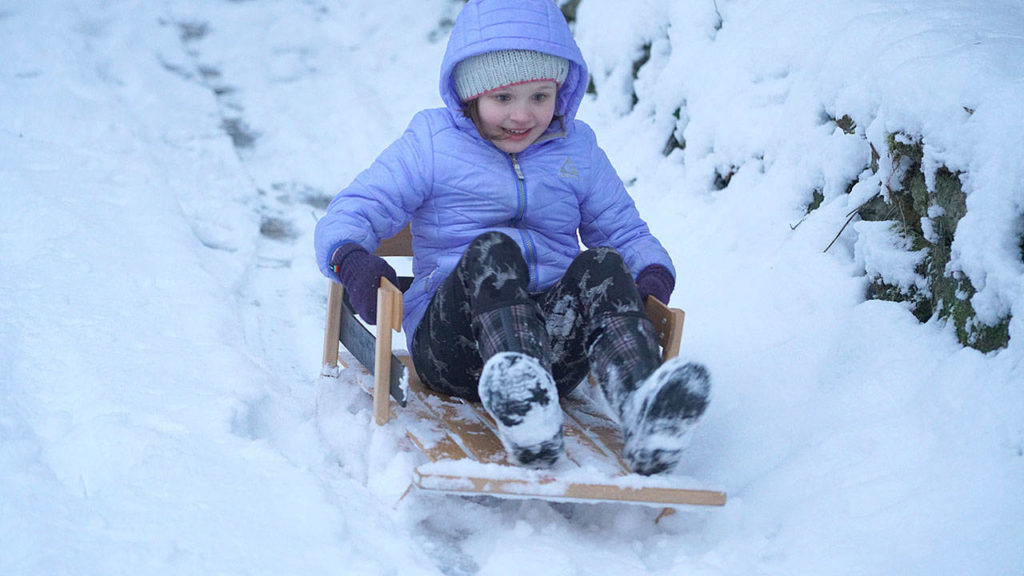 Emogene Shaw, 6, of Snohomish, missed the snow last year and so she planned an entire adventure this time. She spent the day hiking and following animal tracks, hiked up the hill behind her house, painted in the snow, and finished the day by sledding down the driveway. (Sabrina Shaw)
