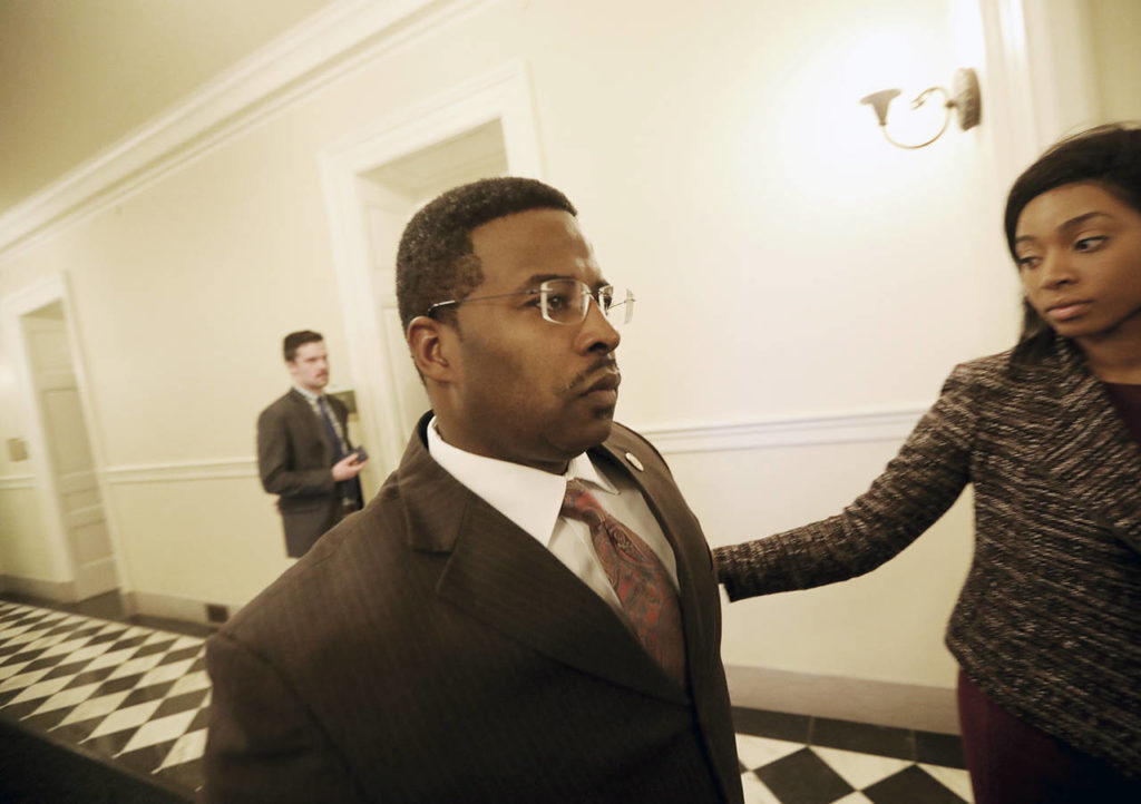 Del. C.E. Cliff Hayes, Jr., D-Chesapeake, leaves the Democratic Caucus meeting Wednesday in Richmond, Virginia, after learning that Virginia Attorney General Mark Herring admitted to wearing a blackface. (Steve Earley/The Virginian-Pilot via AP)

