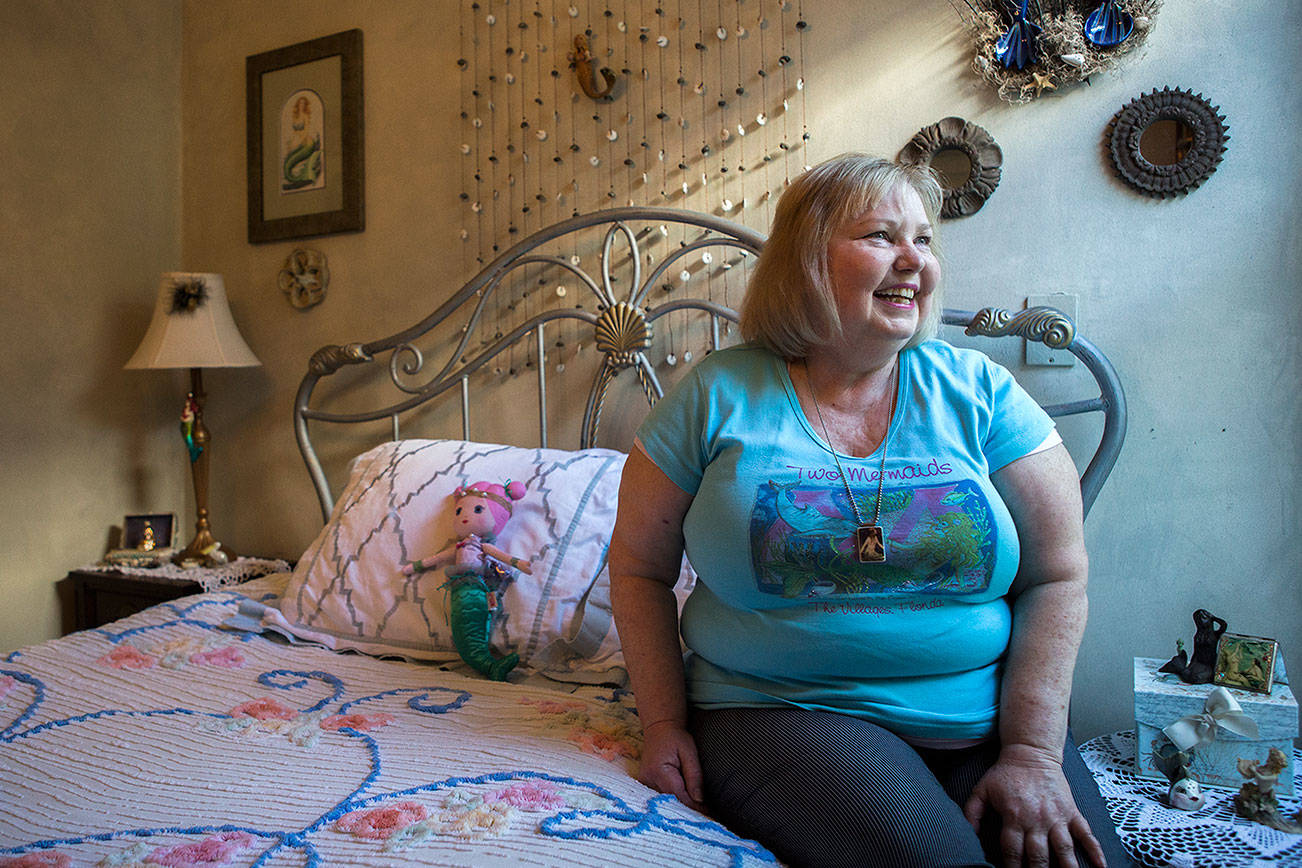 Melissa Strash in her mermaid themed room at her home in Everett. (Olivia Vanni / The Herald)
