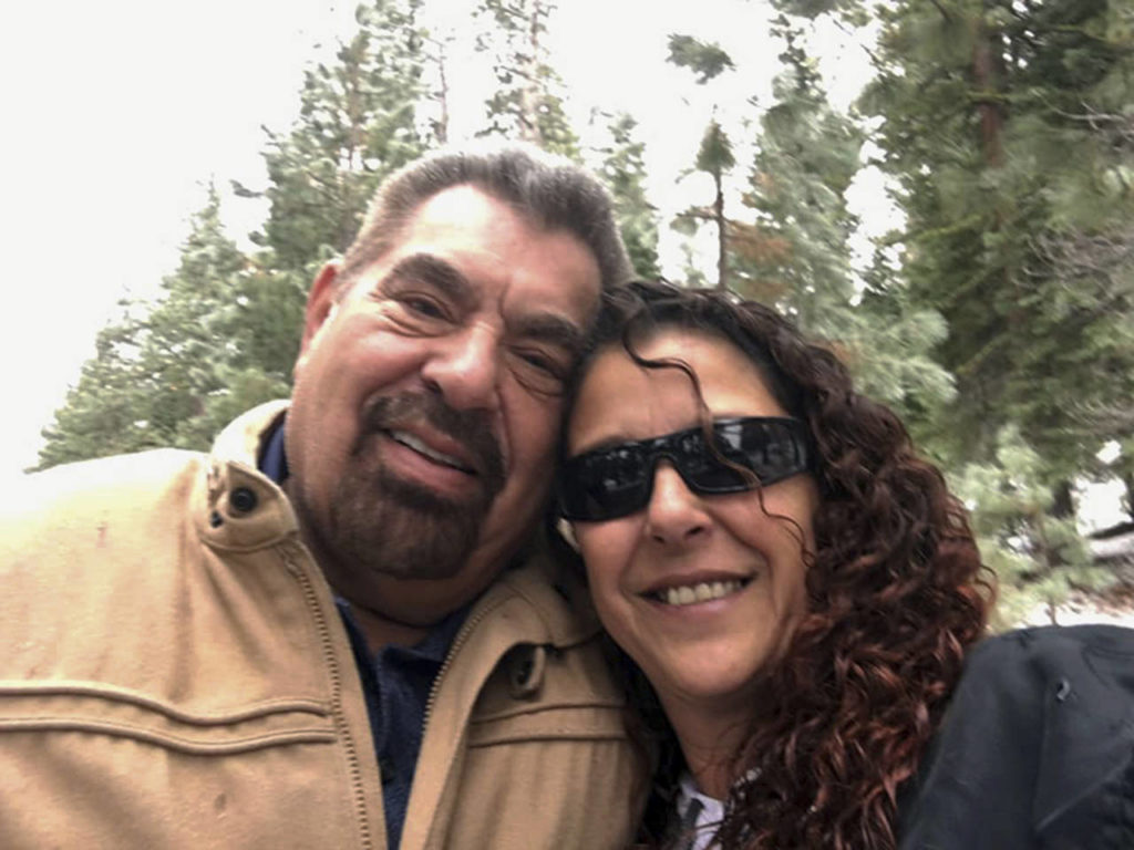 This 2018 selfie by Julia Ackley shows herself and her father, Antonio Pastini, at Lake Tahoe near Carson City, Nevada. Pastini, who had also gone by Jordan Isaacson and was known for years as Ike, was killed while piloting a small plane that crashed into a house in Yorba Linda, California on Feb. (Julia Ackley via AP, File)
