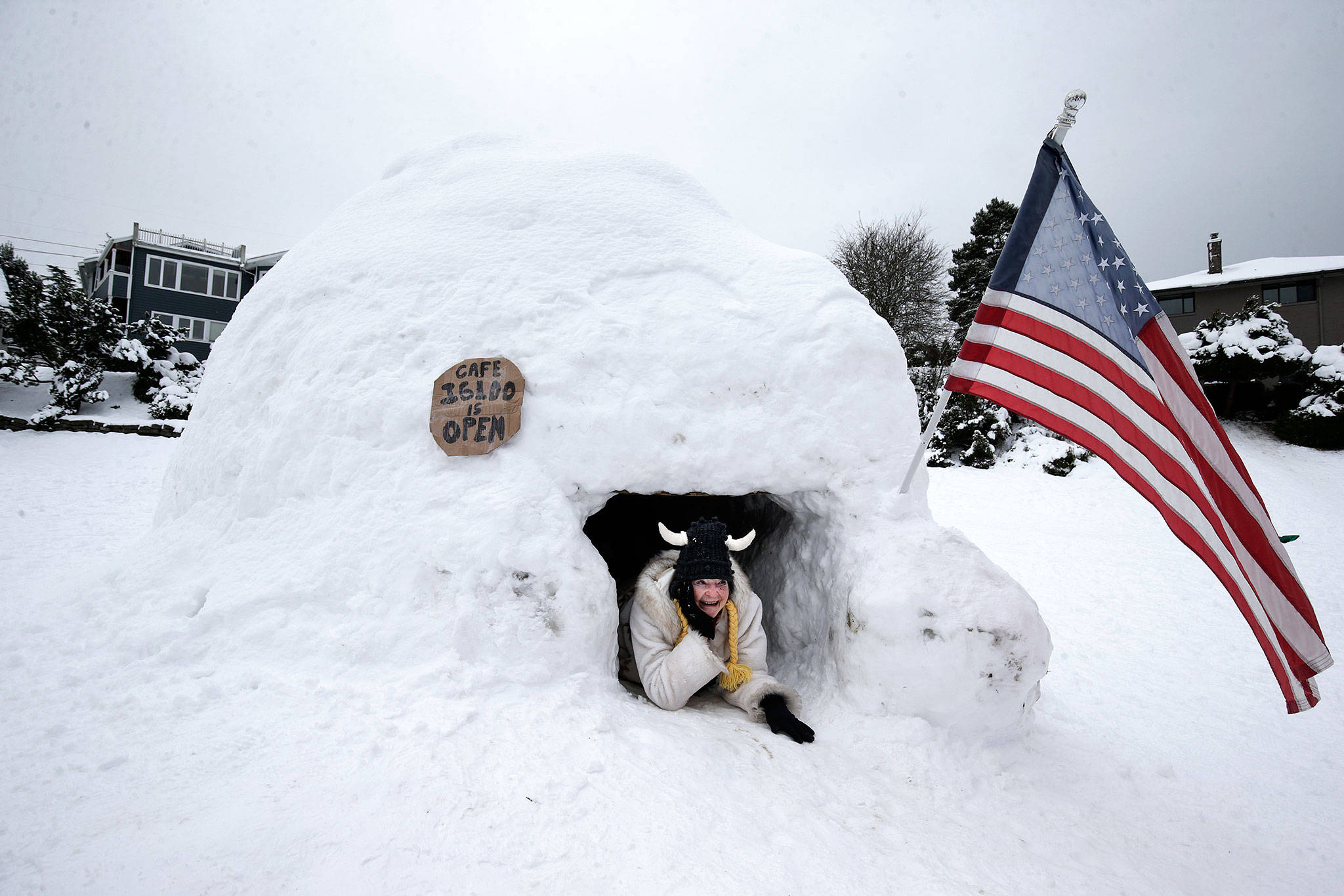Cherie Hansen poses for a photo in the doorway of the “Cafe Igloo” in Rucker Hill Park on Monday in Everett. (Andy Bronson / The Herald)