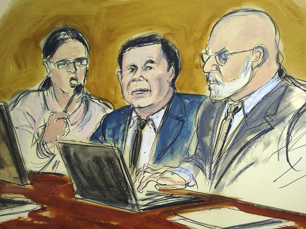 In this courtroom drawing, Joaquin “El Chapo” Guzman (center) sits at the defense table while listening to Judge Brian Cogan addressing the jury, Feb. 7, during Guzman’s drug trafficking trial in New York. (Elizabeth Williams via AP)