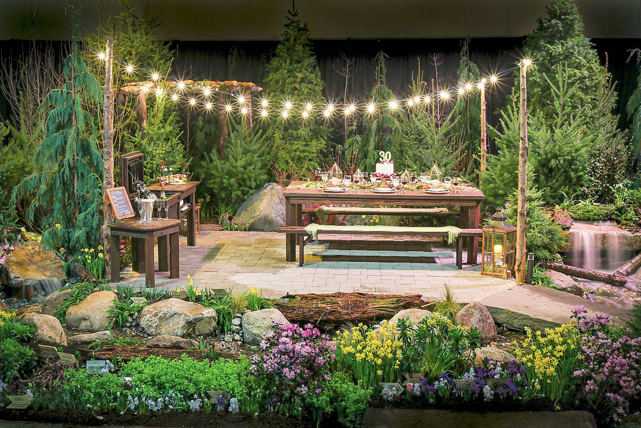 The annual Northwest Flower & Garden Festival, which begins Wednesday in Seattle, is expected to drawn as many as 60,000 people. Shown here is a display garden at last year’s show, titled “Bee Simple!,” designed by Susan Browne Landscape Design of Everett. (Northwest Flower & Garden Festival)