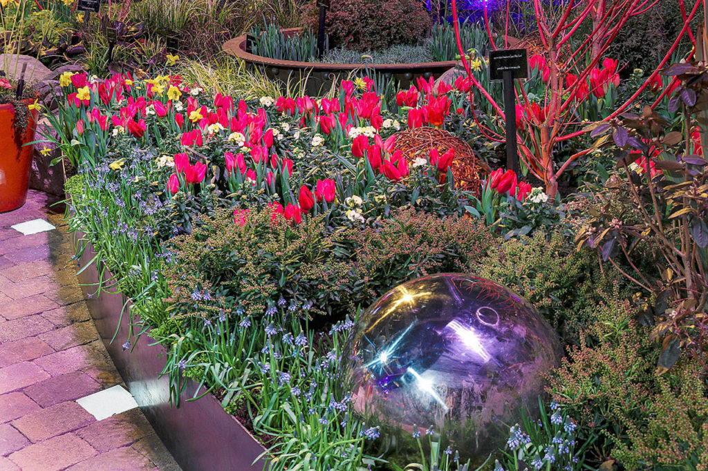 The Northwest Flower & Garden Festival is known for its display gardens, such as “Mother Nature as Muse: Mixing Magic & Materials,” by Millennium Landscape & Construction of Snohomish at last year’s event. (Northwest Flower & Garden Festival)
