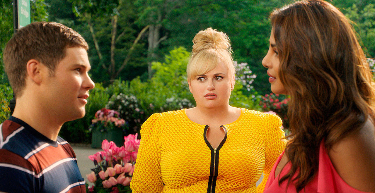 Adam Devine, Rebel Wilson and Priyanka Chopra star in the rom-com sendup “Isn’t It Romantic.” (Warner Bros. Pictures)