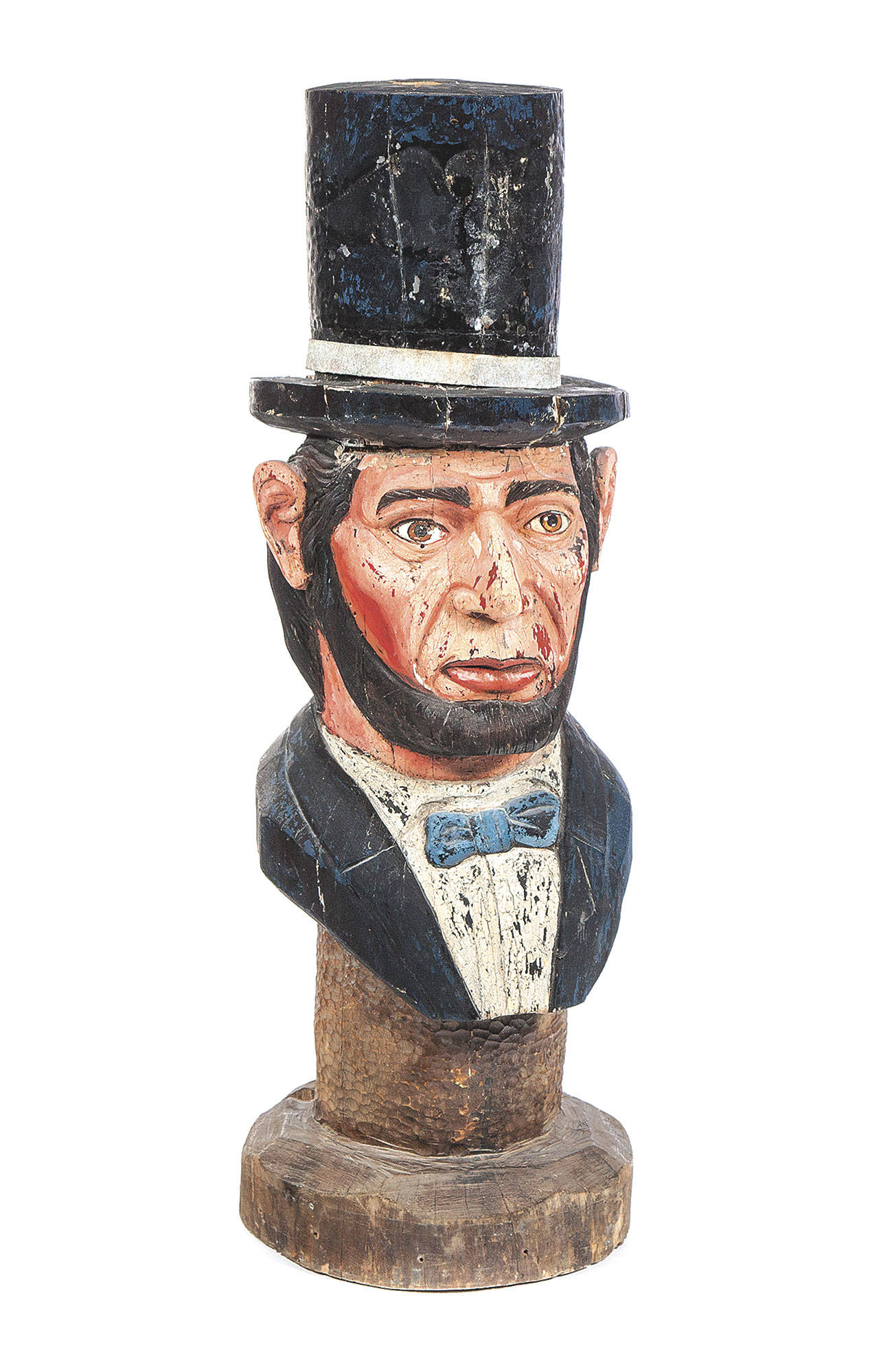 This folk-art carving of President Abraham Lincoln was made from a tree stump in the late 1800s. It is 47 inches tall. The sculpture sold for $1,800 at a recent Garth’s auction. (Cowles Syndicate Inc.)