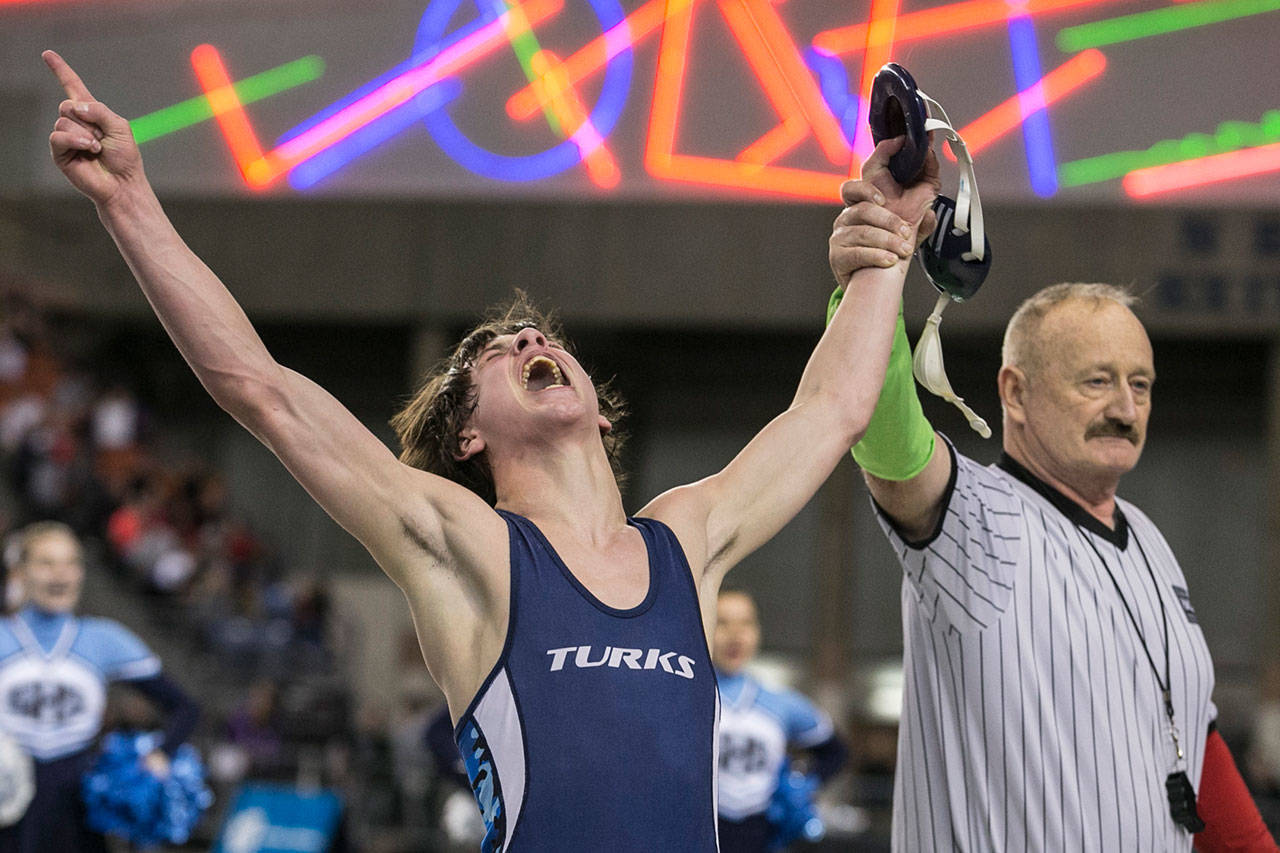 Sultan’s Luke Weaver celebrates winning the Class 1A 120-pound state title during the 30th Annual Mat Classic on Feb. 17, 2018 at the Tacoma Dome. Weaver, who will compete at 126 pounds this weekend, is one of many local athletes set to participate in Mat Classic XXXI. (Kevin Clark / The Herald)