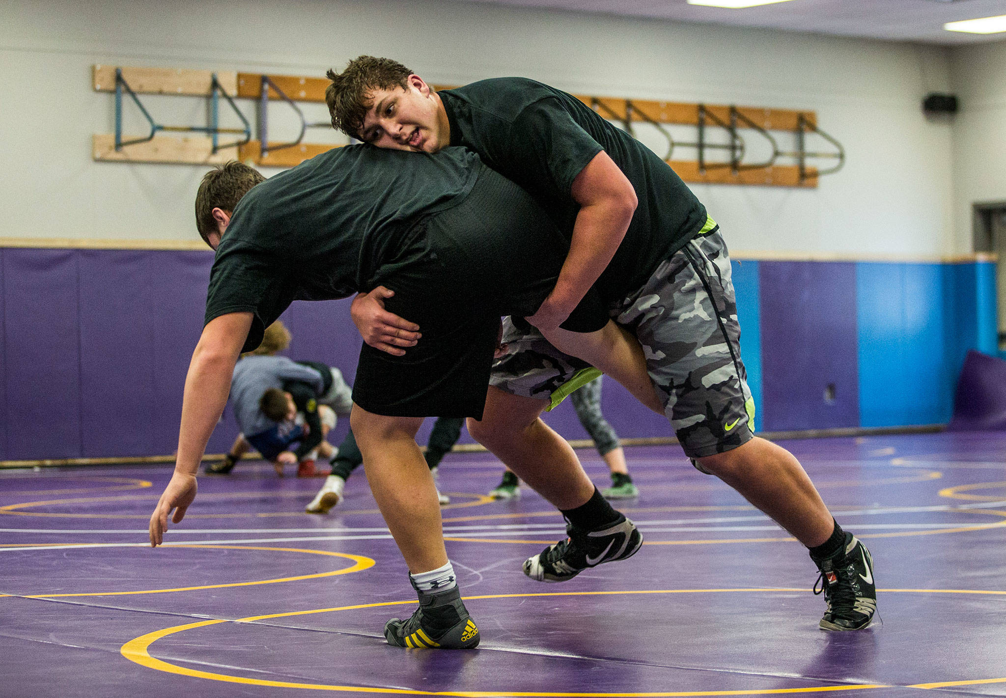 Lake Stevens’ Devin Kylany wrestles teammate Wyatt Hall during a Wednesday practice session in Lake Stevens. (Olivia Vanni / The Herald)