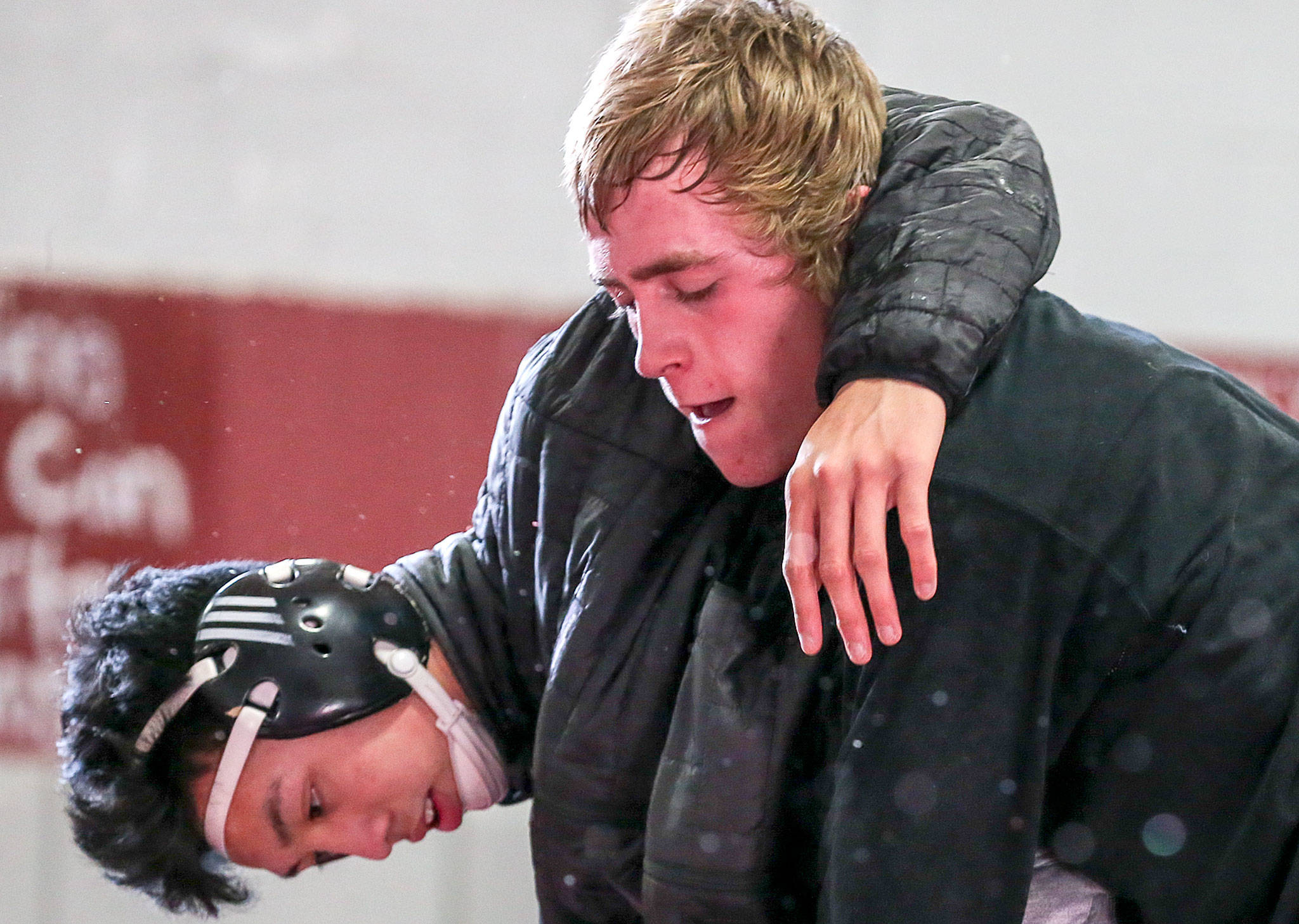 Cascades Kaige Bunsngeam (left) wrestles teammate Chris Shaffer during a Wednesday practice session in Everett. (Kevin Clark / The Herald)