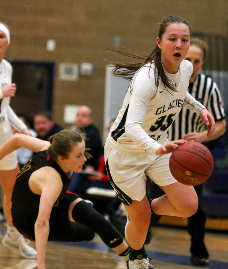 Glacier Peak’s Maya Erling steals the ball from Newport’s Eva Richards on Thursday at Glacier Peak High School. (Kevin Clark / The Herald)
