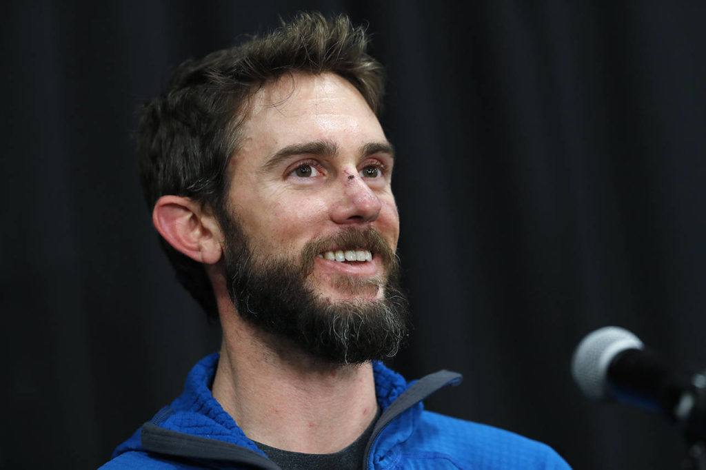 Travis Kauffman responds to questions during a news conference Feb. 14 in Fort Collins, Colorado, about his encounter with a mountain lion while running a trail just west of Fort Collins last week. (AP Photo/David Zalubowski)
