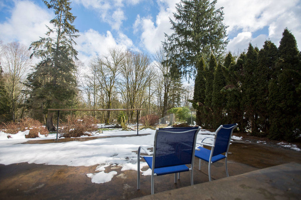 Their Lake Stevens home has a back yard with a large patio and a hot tub. (Olivia Vanni / The Herald)
