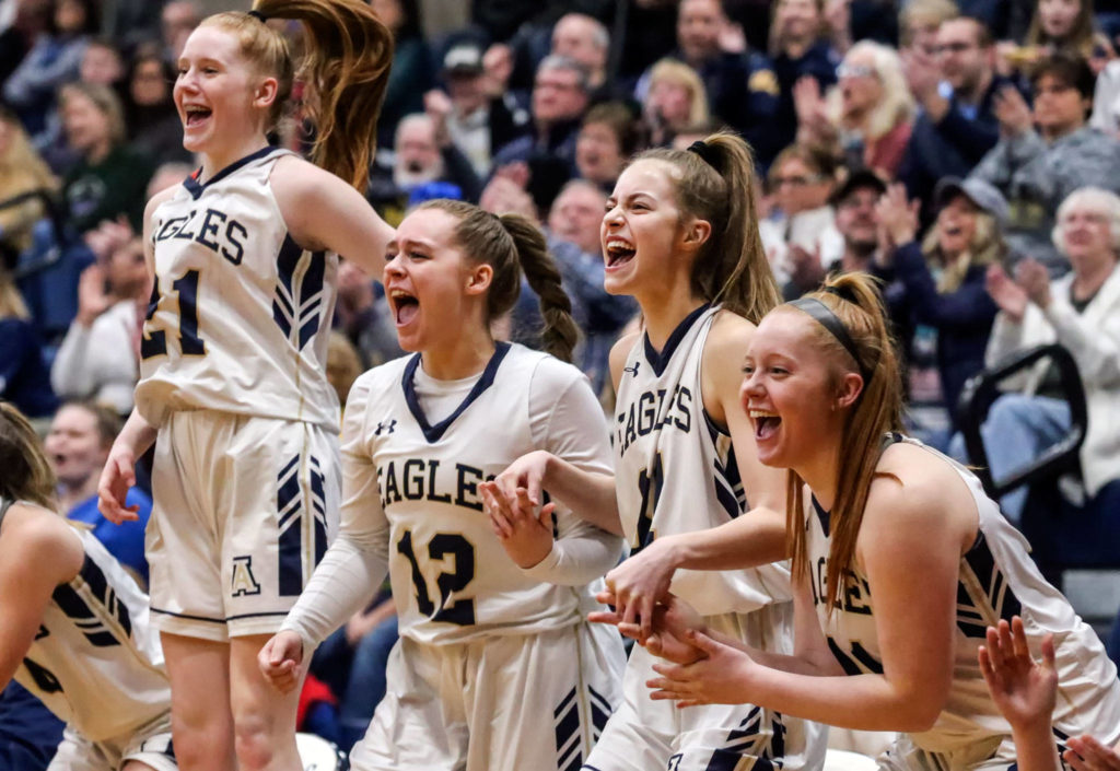 Arlington celebrate the action on the court against Edmonds-Woodway during the 3A district tournament Friday night at Arlington High on February 15, 2019 in Arlington. The Eagles won 55-38. (Kevin Clark / The Herald)
