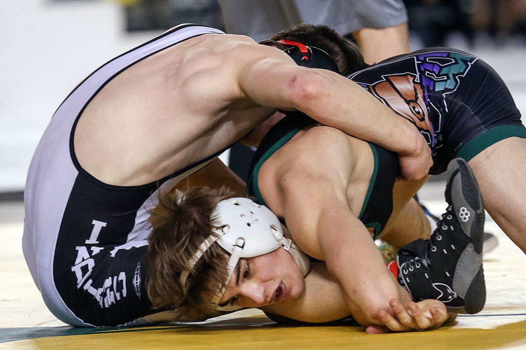 Edmonds-Woodway’s Grayson LeCompte (bottom) falls to North Central’s Clayton Gilliam in the 3A 126 weight class Saturday night during the Mat Classic XXXI at the Tacoma Dome on February 15, 2019 in Tacoma. (Kevin Clark / The Herald)

