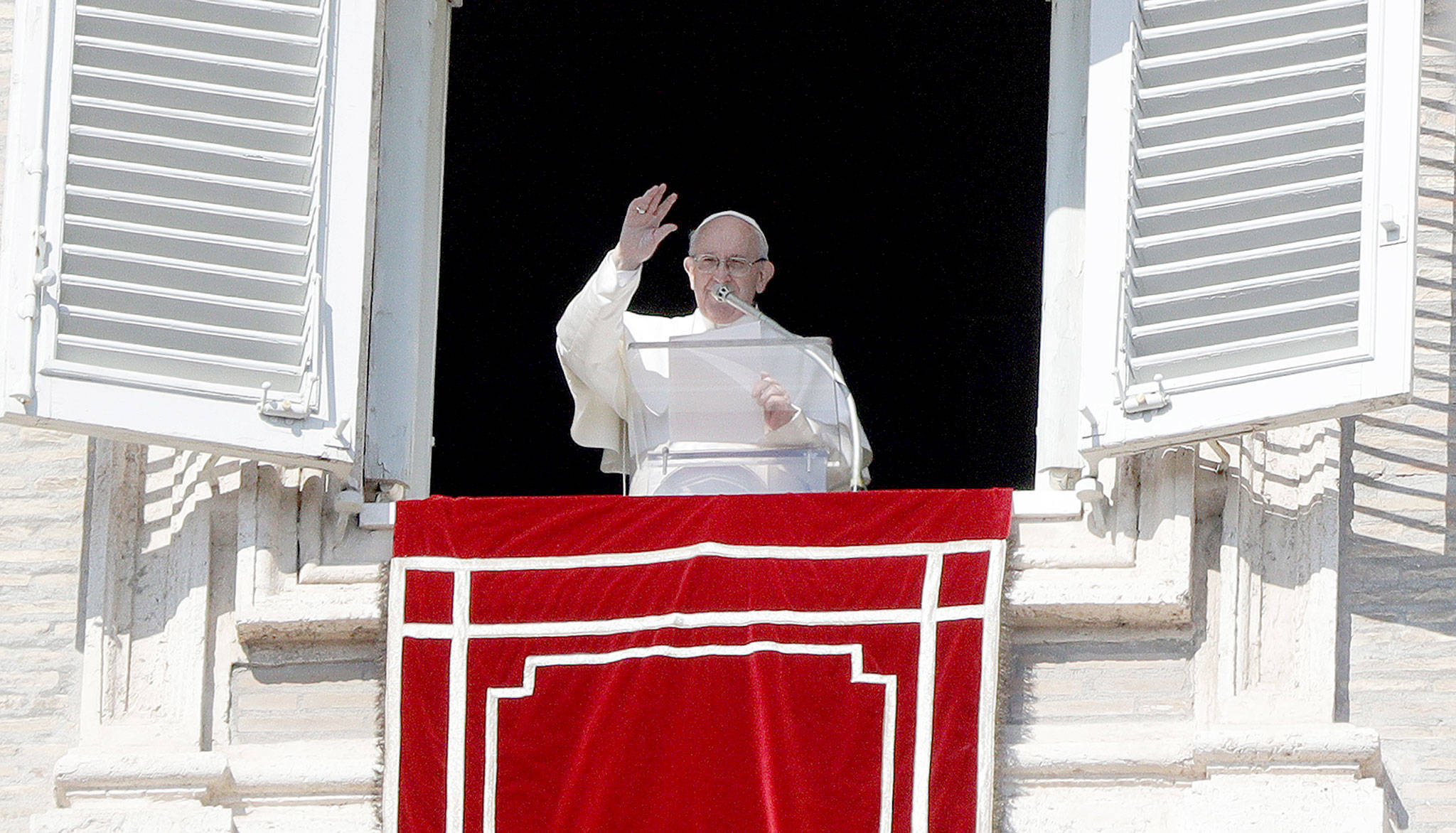 Pope Francis delivers his blessing during the Angelus noon prayer in St. Peter’s Square at the Vatican on Sunday. (AP Photo/Gregorio Borgia)