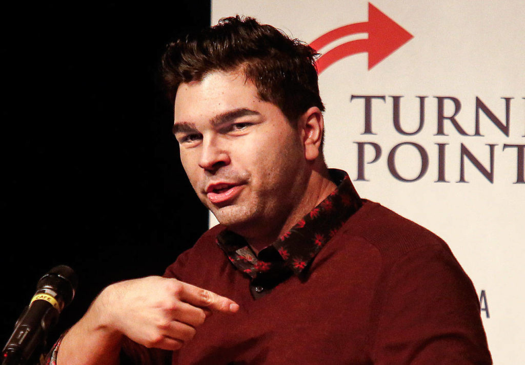 Jason Rantz, a conservative radio talk show host with KTTH, introduced speaker Kyle Kashuv, a student from Marjory Stoneman Douglas High School in Parkland Florida. (Dan Bates / The Herald)
