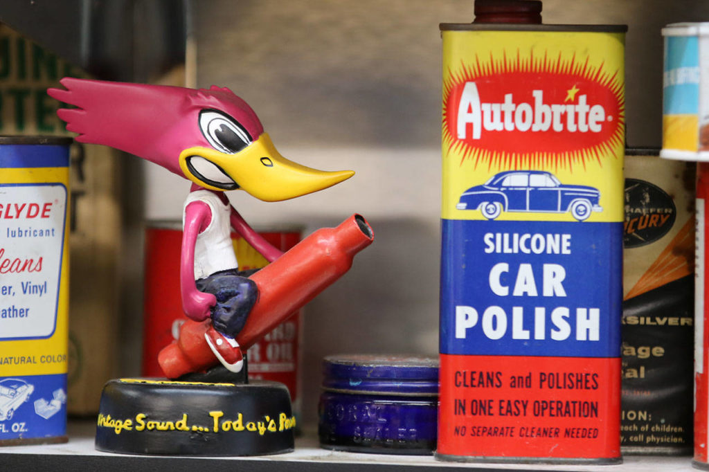 A vintage collection of cans and nicknacks decorate the shelves of Edmonds Auto Parts. (Kevin Clark / The Herald) 
