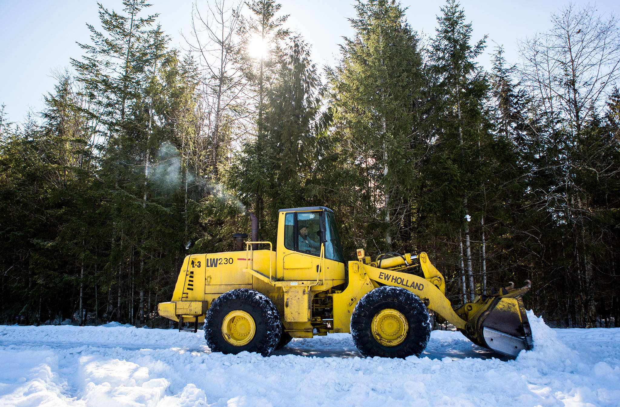 Kenny Friddle plows North Mountain Road next to Whitehorse Community Park on Thursday in Darrington. (Olivia Vanni / The Herald)