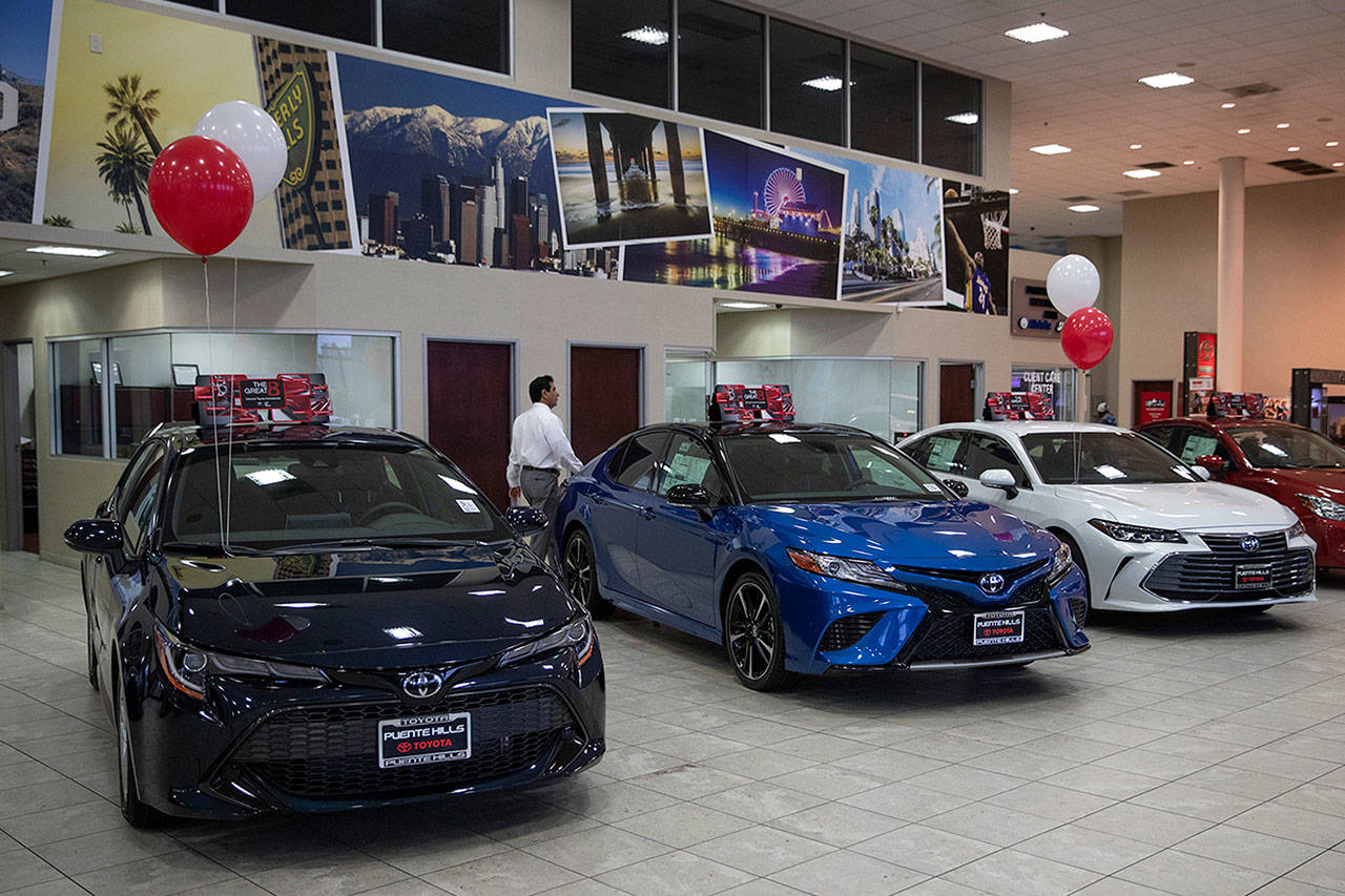 If 25 percent tariffs are fully assessed against imported parts and vehicles, such as these Toyotas at a dealer in California, and they include Canada and Mexico, the price of imported vehicles would rise more than 17 percent, or around $5,000 each, according to forecasts from IHS Markit. (Associated Press)
