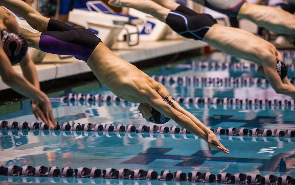 Kamiak’s Maxwell Fang dives off the block during the 200 Yard Freestyle Relay during the 4A Boys’ Swim/Dive Championships on Saturday, Feb. 16, 2019 in Federal Way, Wash. (Olivia Vanni / The Herald)
