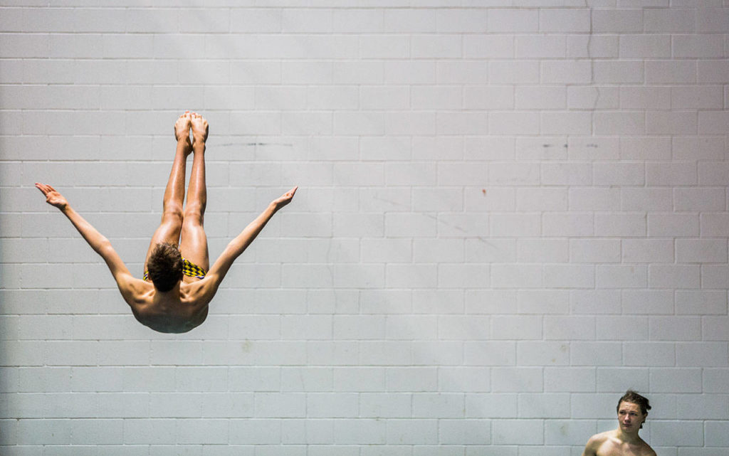 Divers warm up before the start of the 3A Boys’ Swim/Dive Championships on Saturday, Feb. 16, 2019 in Federal Way, Wash. (Olivia Vanni / The Herald)
