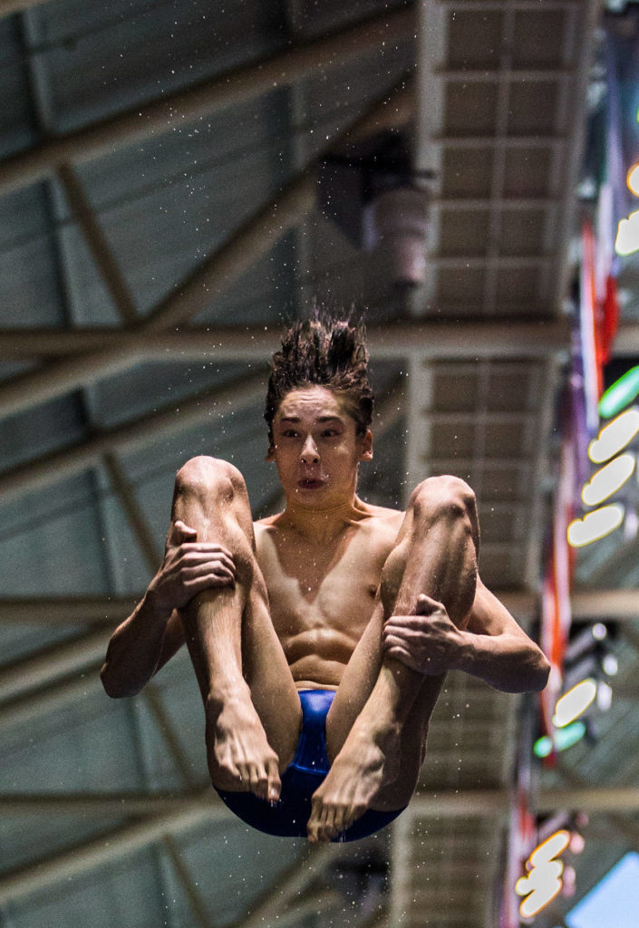 Shorewood’s Isaac Poole warms up before the Mens 1 Meter Diving during the 3A Boys’ Swim/Dive Championships on Saturday, Feb. 16, 2019 in Federal Way, Wash. (Olivia Vanni / The Herald)
