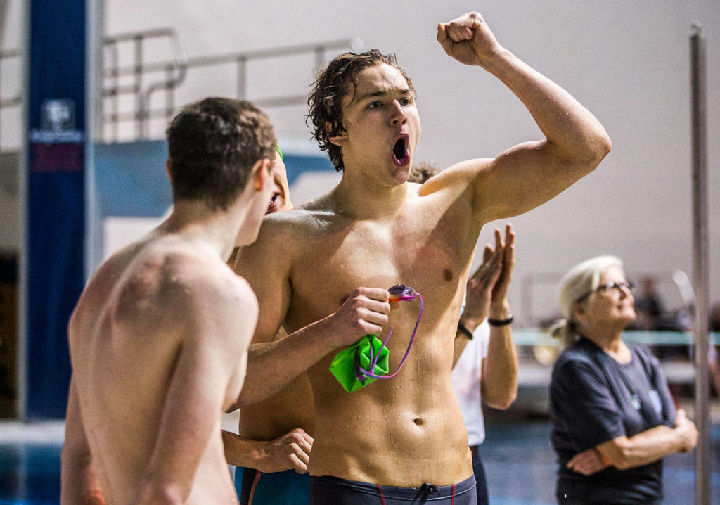 Shorewood’s Jack Brodersen pumps his fist in the air after seeing his teams’ 200 Yard Medley Relay time during the 3A Boys’ Swim/Dive Championships on Saturday, Feb. 16, 2019 in Federal Way, Wash. (Olivia Vanni / The Herald)
