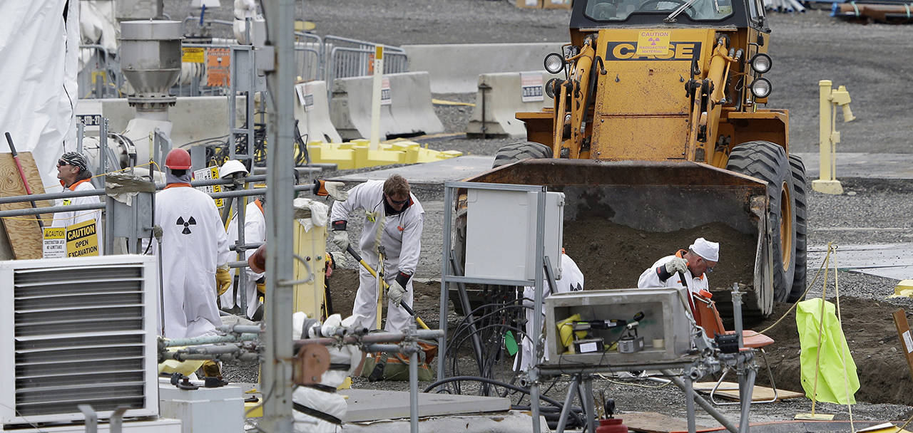 In this 2013 hoto, workers are shown at the ‘C’ Tank Farm at the Hanford Nuclear Reservation, near Richland. (AP Photo/Ted S. Warren, File)