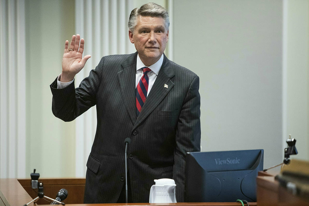 Mark Harris, Republican candidate in North Carolina’s 9th Congressional race, prepares to testify during the fourth day of a public evidentiary hearing on the 9th Congressional District voting irregularities investigation Thursday at the North Carolina State Bar in Raleigh, North Carolina. (Travis Long/The News & Observer via AP, Pool)