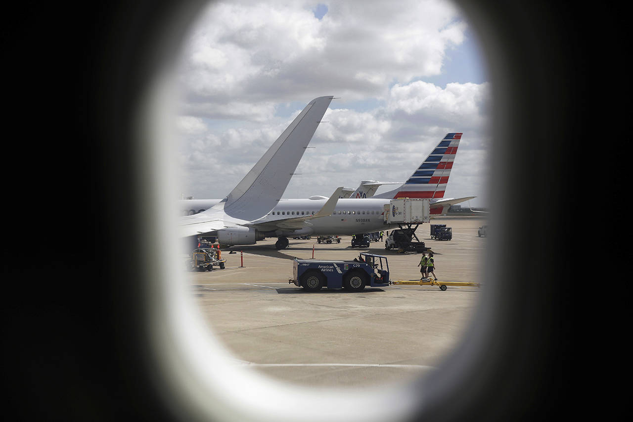American Airlines aircrafts aircrafts are seen at O”Hare International Airport in Chicago. (AP Photo/Kiichiro Sato, File)