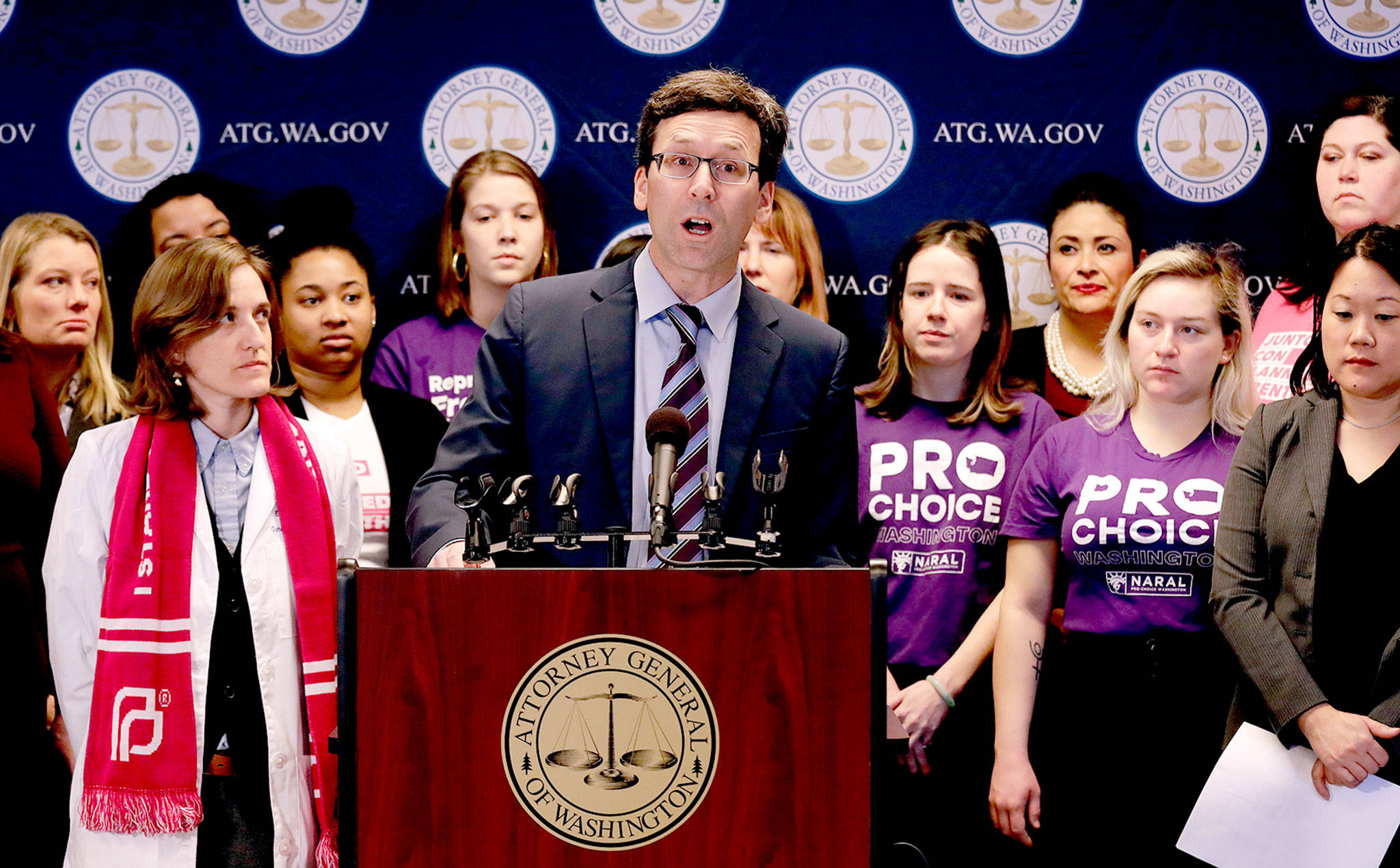 Washington state Attorney General Bob Ferguson speaks at a news conference on Monday in Seattle announcing a lawsuit challenging the Trump administration’s Title X “gag rule,” which would affect federal funding for reproductive health care and family planning services. (AP Photo/Elaine Thompson)