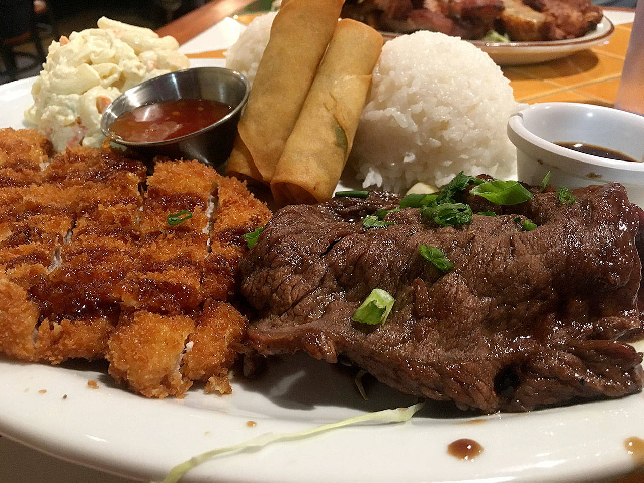 The Waimea dish at Kona Kitchen in Lynnwood comes with katsu pork, teri beef, two egg rolls, two mounds of white rice and the Hawaiian staple of macaroni salad. (Ben Watanabe / The Herald)