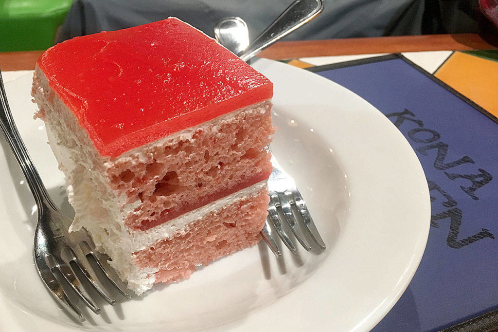 A hefty slice of guava cake, baked by Cakes of Paradise, is a perfect finish to a meal at Kona Kitchen in Lynnwood. (Ben Watanabe / The Herald)
