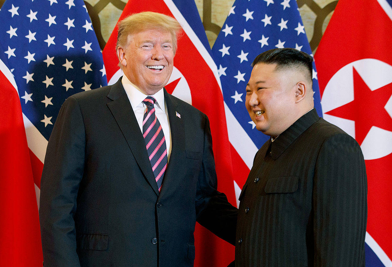 President Donald Trump meets North Korean leader Kim Jong Un on Wednesday in Hanoi. (AP Photo/ Evan Vucci)